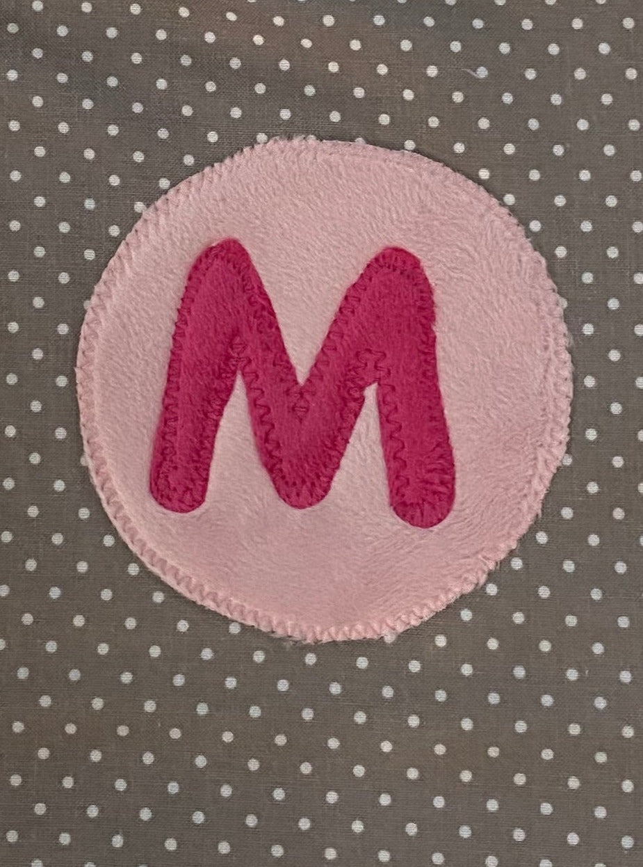 Tiny dot bib with hot pink initial and light pink circle
